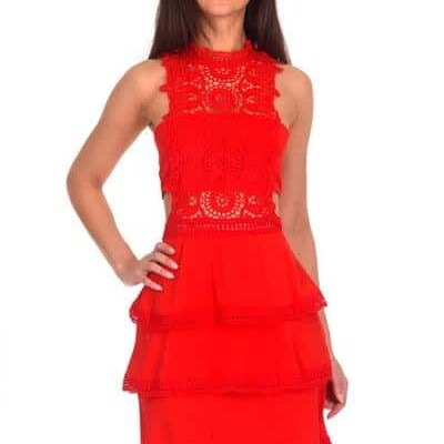 Teenager wearing a AX Paris Crochet Halter Dress in Red. Chiffon and lace with cut out sides and a fun flirty tiered skirt from Silhouette London, Girls party dress specialists in London