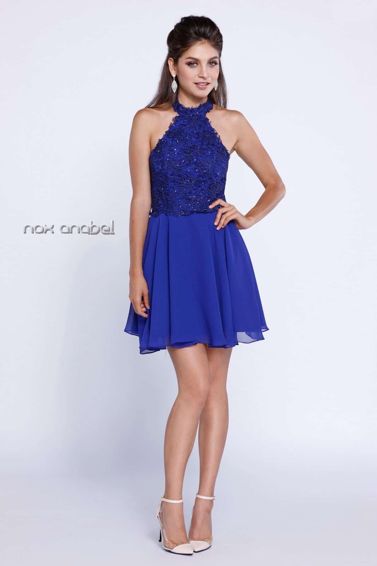 Pre-loved Nox Anabel Style 6210 Royal Blue 1 Young Woman wearing Nox Anabel Party Dress Style 6210 Embellished Lace Halter Neck with low Back and floaty chiffon Skater Skirt in Royal Blue from Party Dress Boutique Silhouette London
