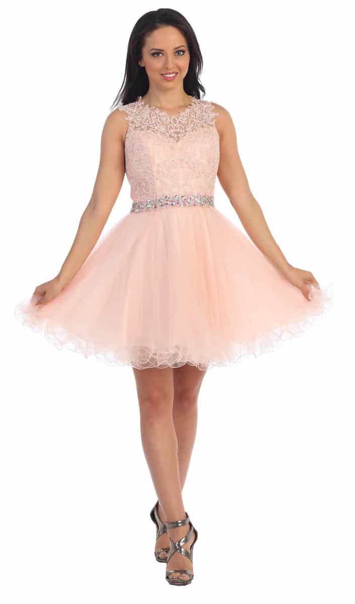 Dancing Queen Dress Style 9159 1 Young women wearing a Dancing Queen Dress Style 9159 in Pink. full lace and crystal bodice with keyhole detail at the back and full tulle skirt from Prom Dress Boutique Silhouette London