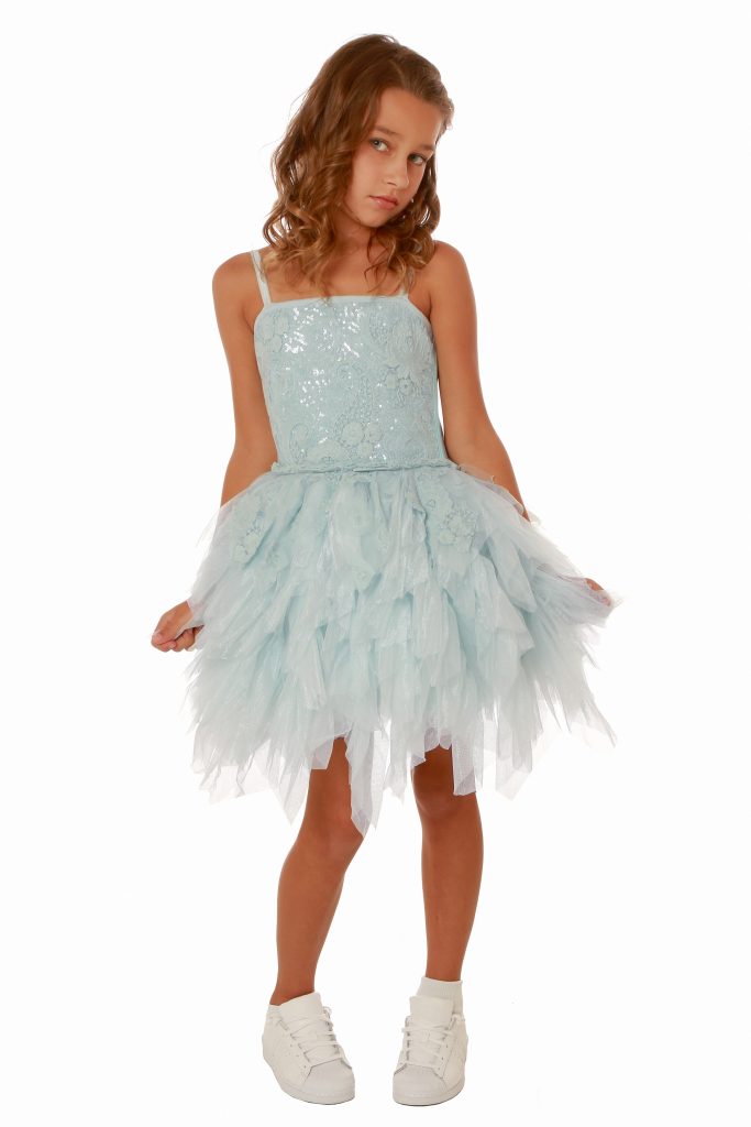 Young girl wearing a Ooh la la Couture Emma Dress in Sky Blue. Gorgeous lace and jersey bodice with spaghetti straps and stunning tiered tulle skirt from Silhouette London, Girls party dress specialists in London.