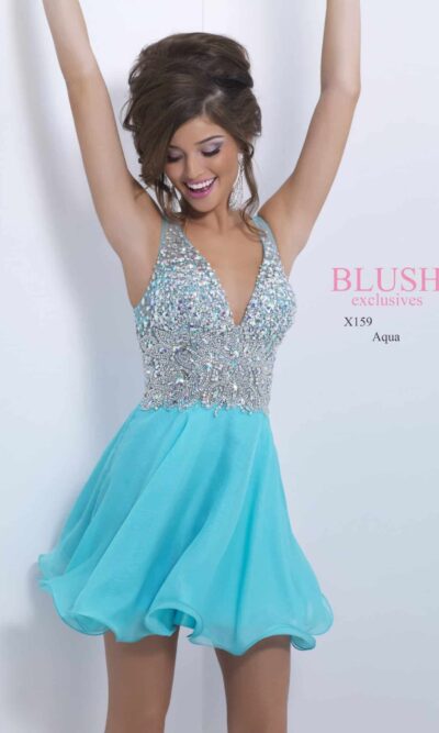 Brunette teenage girl wearing a Blush Prom Dress Style X159 in Aqua. An embellished plunge neck bodice with zip fastening and V back and flowing chiffon skirt from Silhouette London, Girls party dress specialists in London.