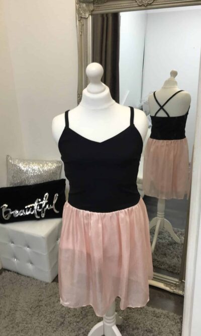 Mannequin wearing a Sally Miller Alexandra Dress with a Black jersey bodice and a Pink chiffon style skirt from Silhouette London a Teen Party Dress Boutique in Greater London