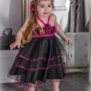 Tulle Floral Dress Style 304 (Black/Fuschia) 4 Young Girl wearing Multi Layer tulle floral Style 304 in Black/Fuschia from Silhouette London, a Girls Party Dress Boutique in Greater London
