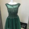 BY Lace and Tulle Party Dress 5 Full Lace Bodice and tulle skirt in Emerald. Illusion neckline, sequin embellished lace bodice and corset closing with full tulle scalloped edge skirt from Silhouette London, Girls party dress specialists in London.