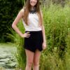 Embellished TFNC Ivory Top 2 Teenage Girl wearing a TFNC Ivory Vest top with black crystal embellishement at the neckline from Silhouette London a Teen Prom and Party Boutique in Greater London