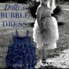 Dolly Bubble dress (Navy) 3 Young girl wearing a Dolly Le Petit Tom Bubble dress in Navy from Silhouette London, Girls party dress specialists in London.