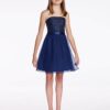 Mon Cheri Lexie Dress Style TW11673 2 Young girl wearing a Mon Cheri Lexie Dress Style TW11673 in Navy. Strapless chiffon over satin above-the-knee A-line dress, hand-beaded lace overlay bodice, satin waistband, chiffon overlay skirt from Prom Dress Boutique Silhouette London.