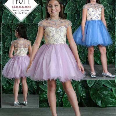 Young girl wearing a Calla Collection Dress Style TY011 Fabulous cap sleeve embellished bodice with gorgeous dusty blue full tulle skirt from Silhouette London, Girls party dress specialist in London