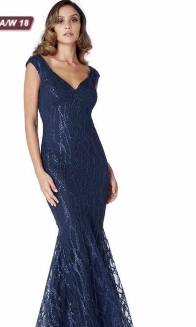 Young women wearing a Sweetheart Sequin Mermaid Dress in Navy. Sequin Mermaid Dress with a sweetheart neckline and cap sleeve and open back with shimmering sequin detail throughout from Prom Dress Boutique Silhouette London