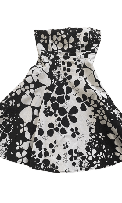 Stunning black and cream floral strapless party dress on a white background available at Silhouette London, a teen party fashion boutique in Greater London