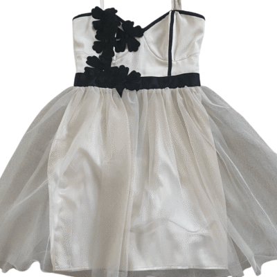 Pre-Loved Cream and Black Lipsy Party dress with tulle overlay and black flower detail on the corset bodice on a white background, available from Silhouette London and Teen Fashion Boutique in Greater London
